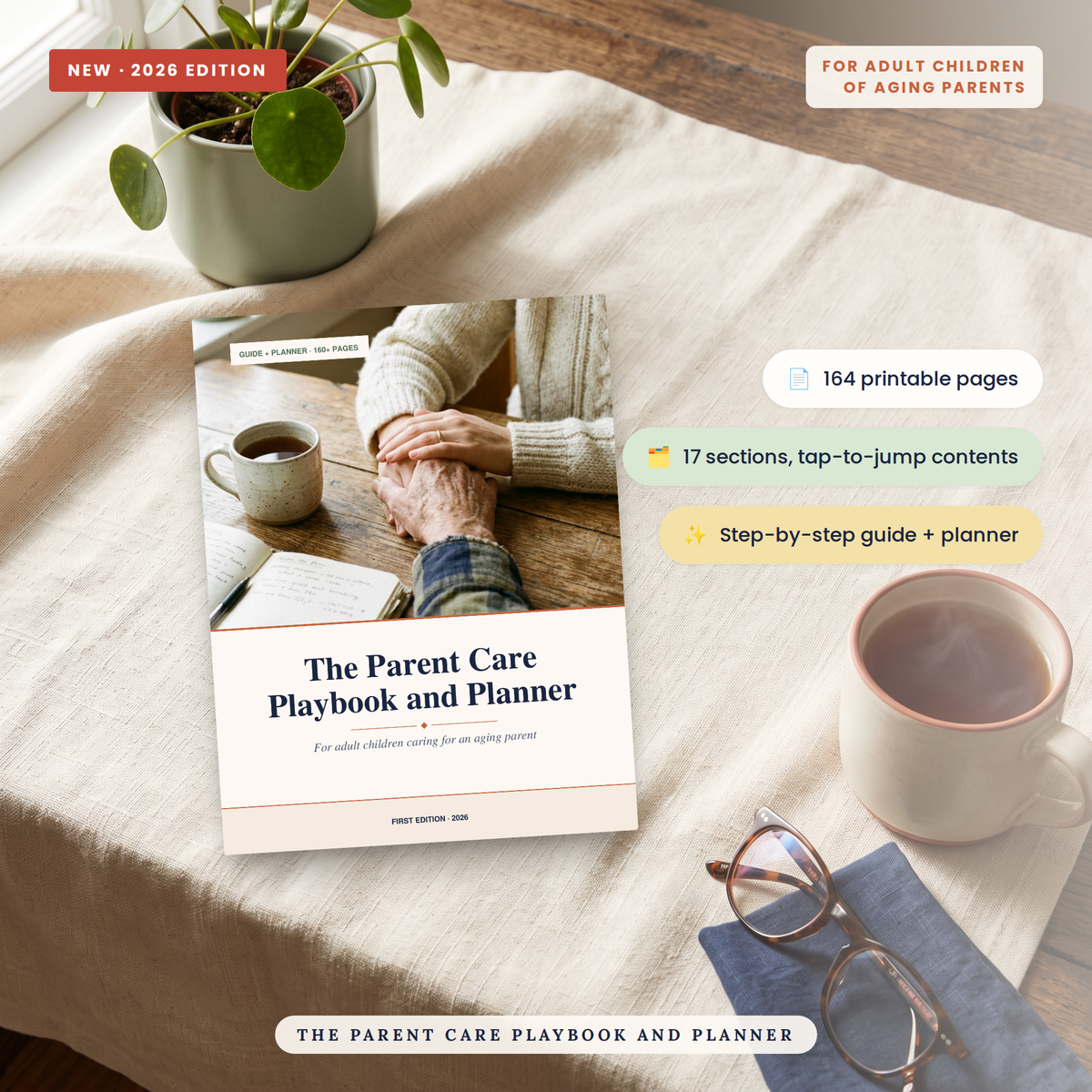 A styled flat-lay of a printed playbook titled "The Parent Care Playbook and Planner" placed on a cream fabric surface with a plant, mugs of coffee, and glasses nearby. The cover shows a photo of an adult child holding an elder's hand.